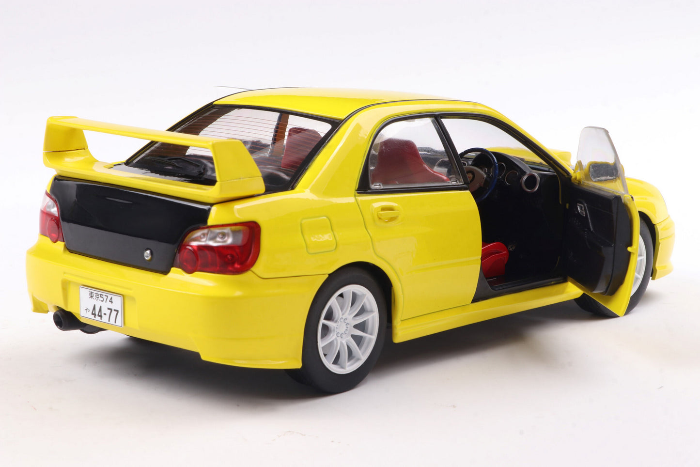 Solido 2003 Subaru WRX STi (GDB) Streetfighter Yellow w/ Black Carbon Hood 1:18