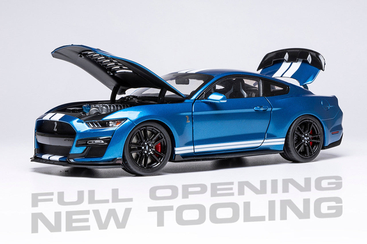 Mustang GT500 Blue model car with open doors on a white background, featuring Ixo Models logo.