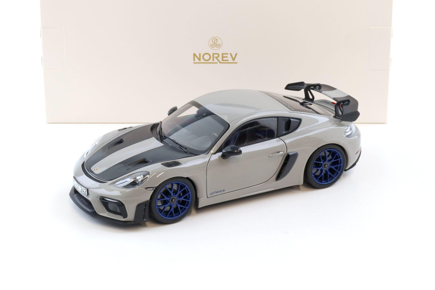Norev 2023 Porsche 718 Cayman GT4 RS w/ Weissach Package Chalk w/ Blue Wheels 1:18