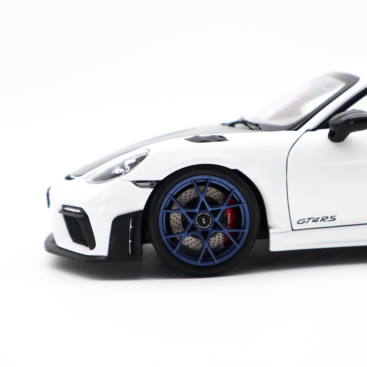Norev 2023 Porsche 718 Cayman GT4 RS w/ Weissach Package White w/ Blue Wheels 1:18