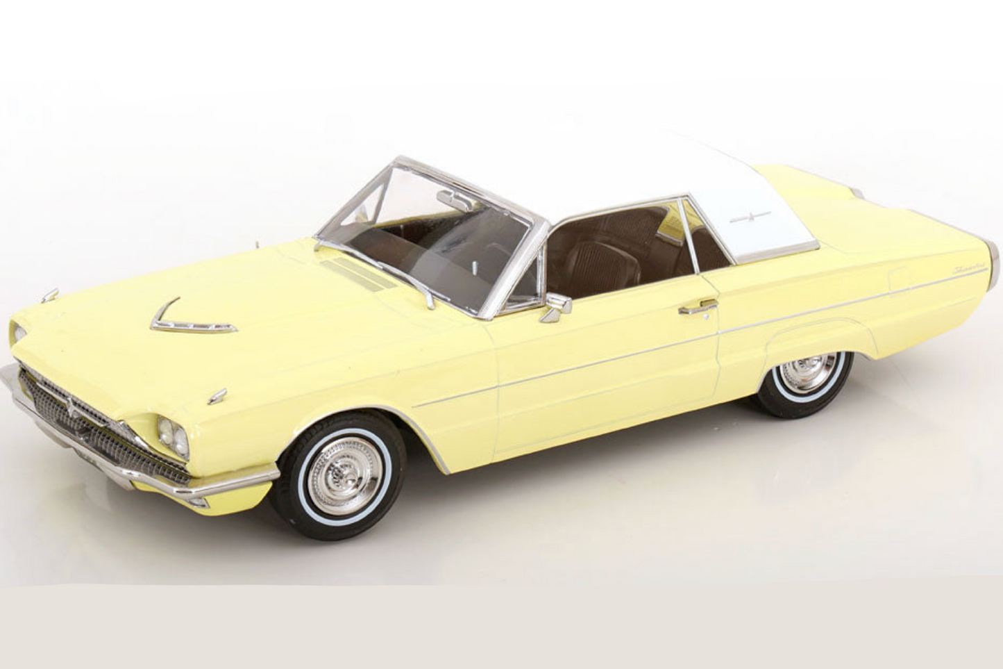 Yellow vintage thunderbird model on a white background