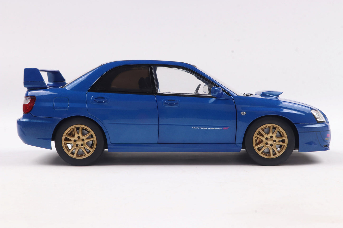 Solido 2003 Subaru WRX STi (GDB) Sonic Blue w/ Gold Wheels 1:18