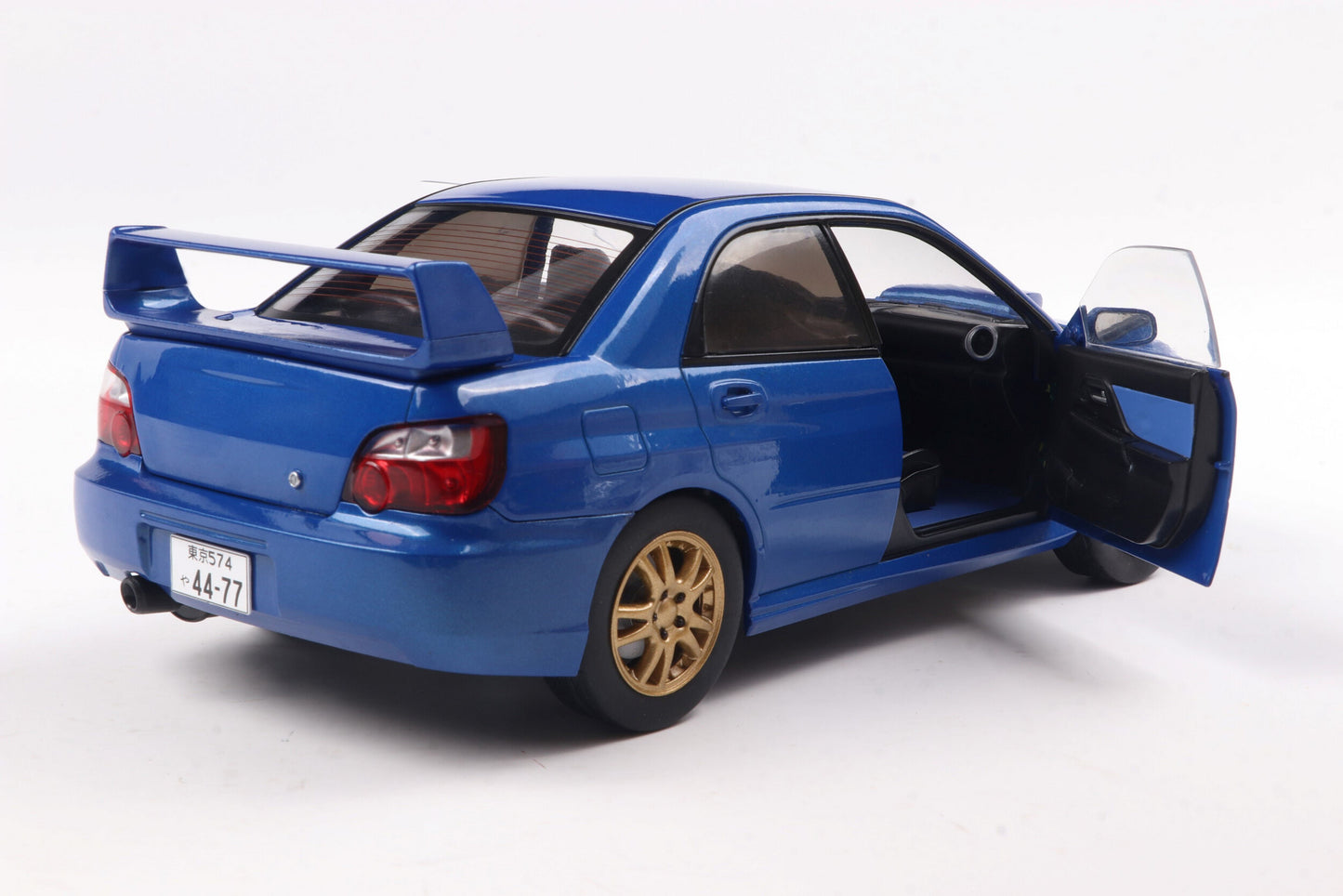 Solido 2003 Subaru WRX STi (GDB) Sonic Blue w/ Gold Wheels 1:18